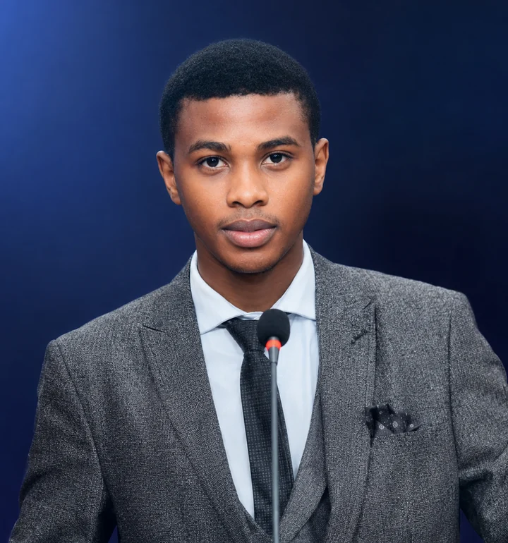 Samson Sibona Njaji wearing a grey suit